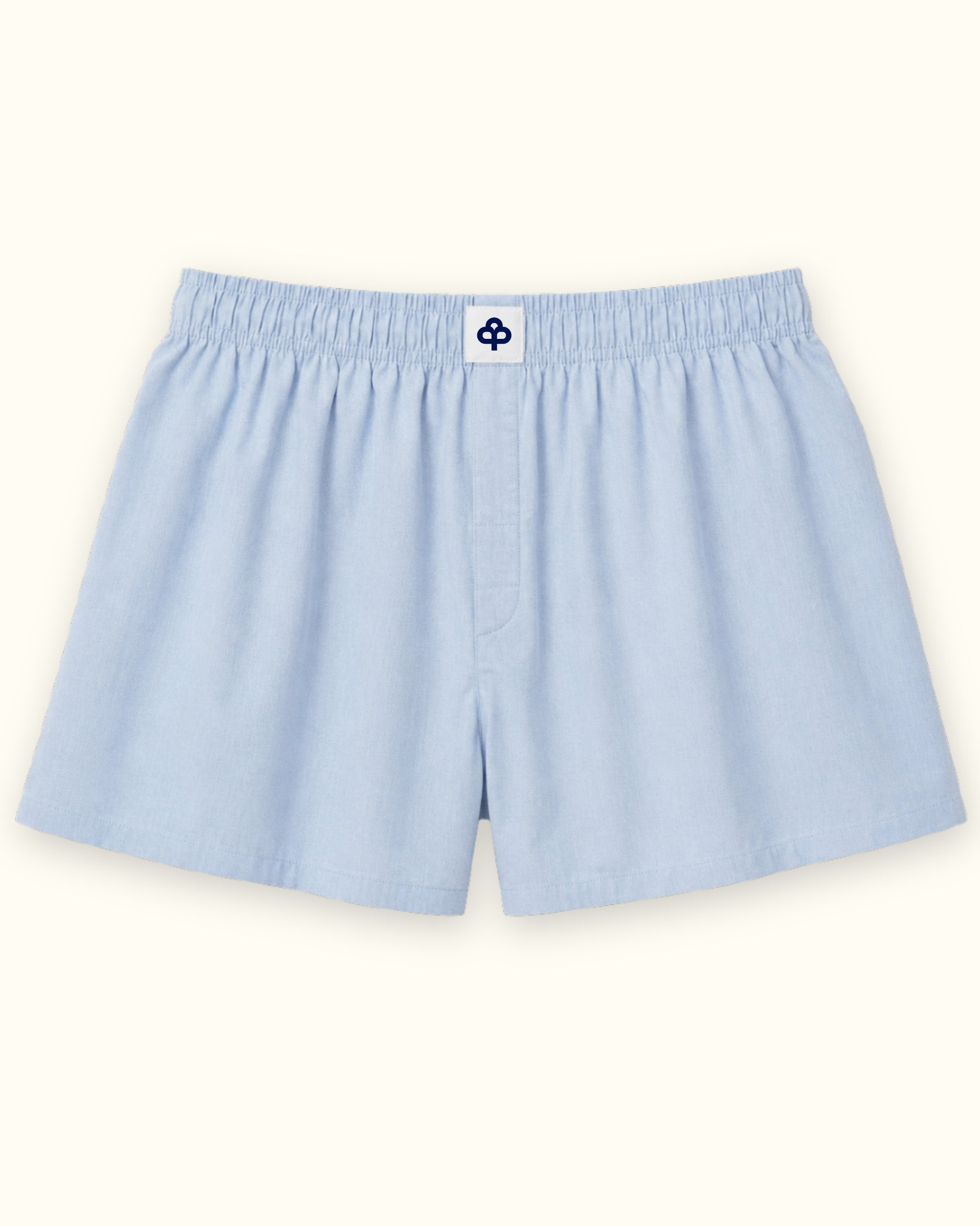 Short tipo bóxer de algodón en azul claro, vista frontal, mostrando la cintura y la forma de la pernera
