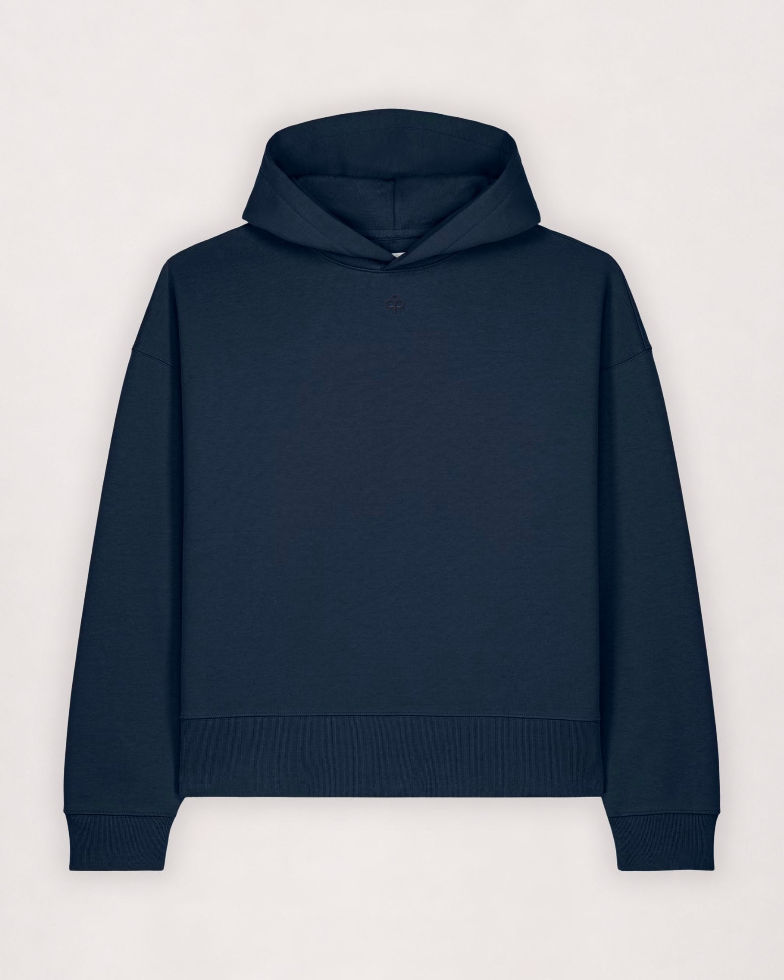 Oversize cotton hoodie in navy, flat lay front view with ribbed hem