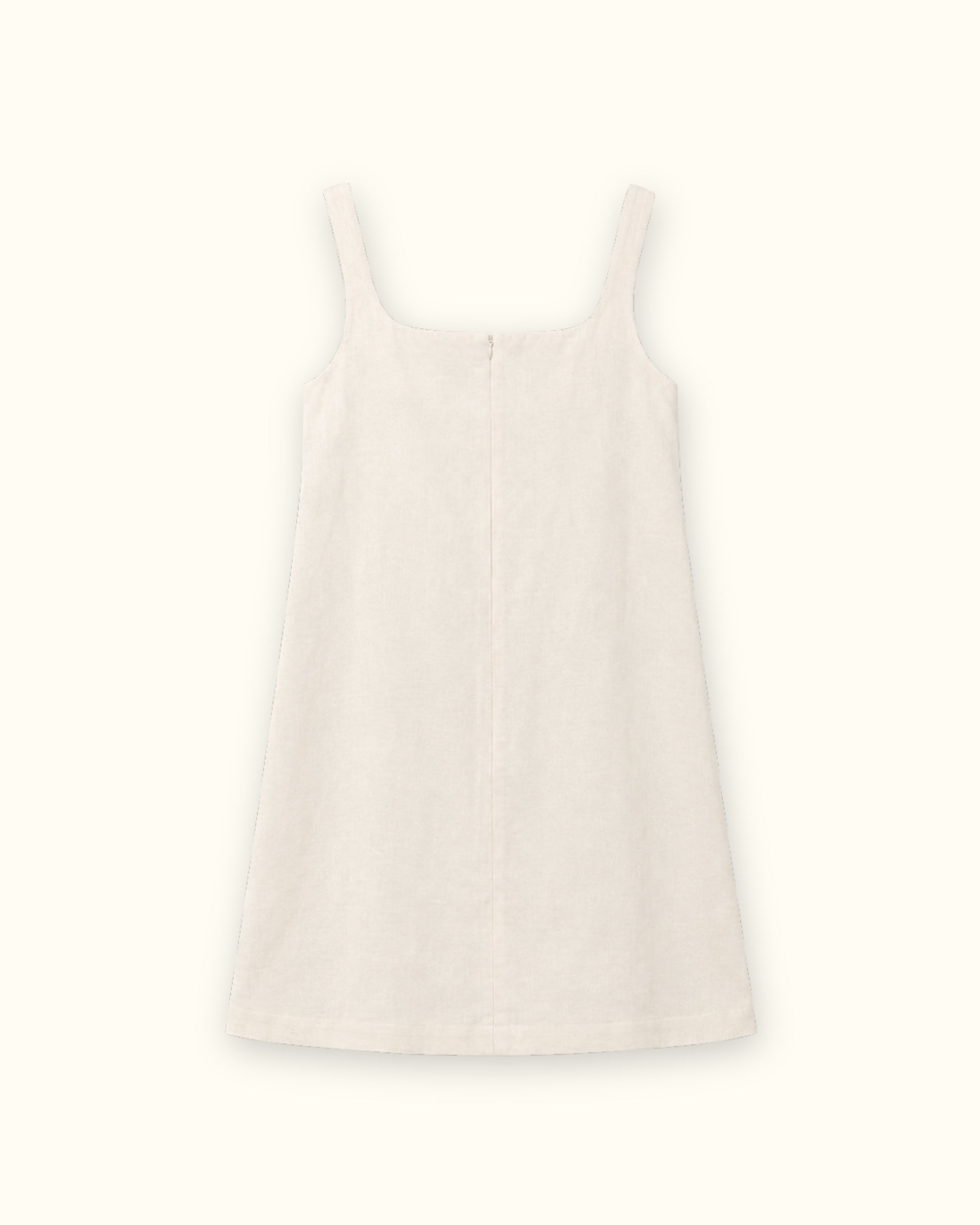 Vestido mini de lino en Off White, vista trasera, mostrando el escote y la silueta del vestido