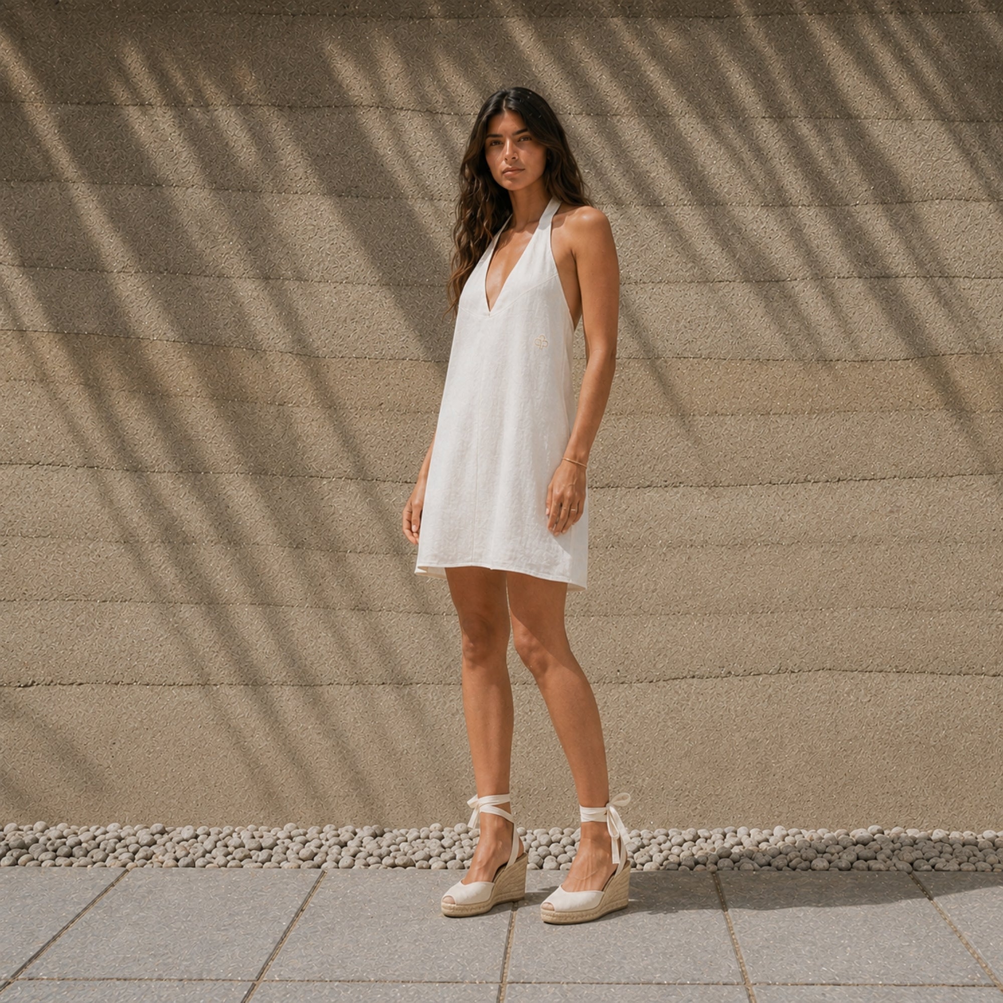 Linen Halter Dress in Off White, lifestyle view 2, showing neckline and dress silhouette