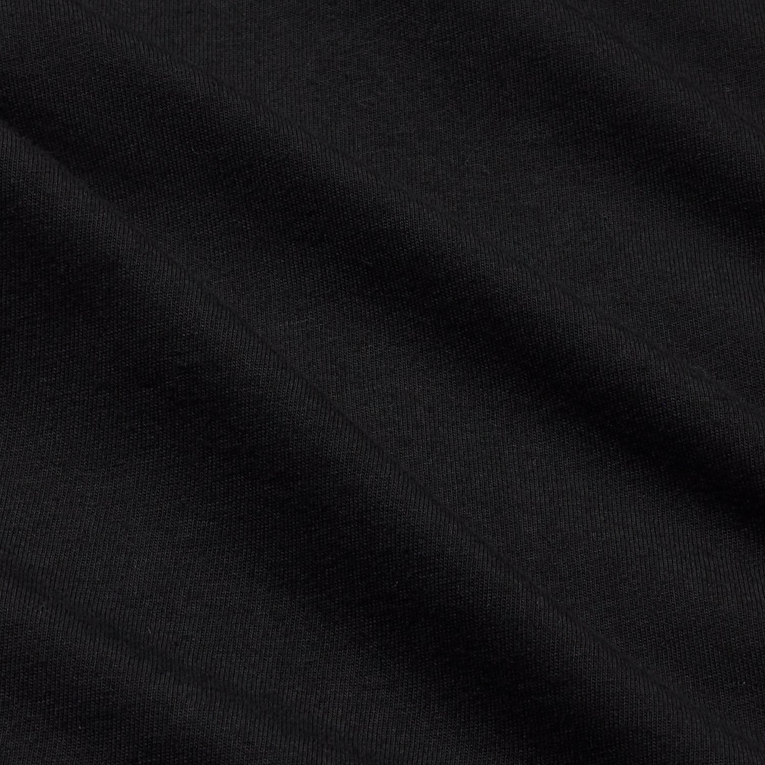 Close-up of smooth black organic cotton fabric.