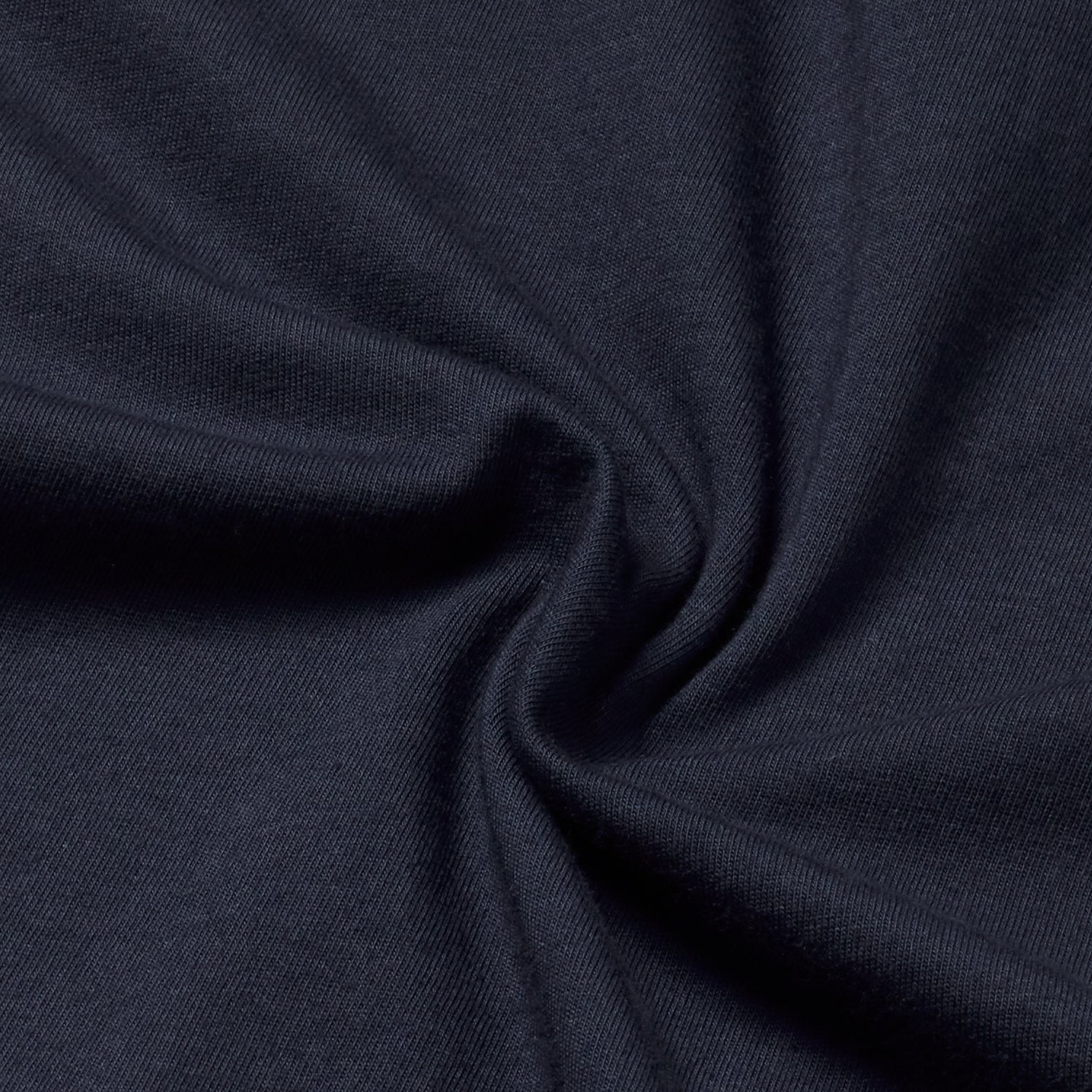 Close-up of navy organic cotton fabric texture.